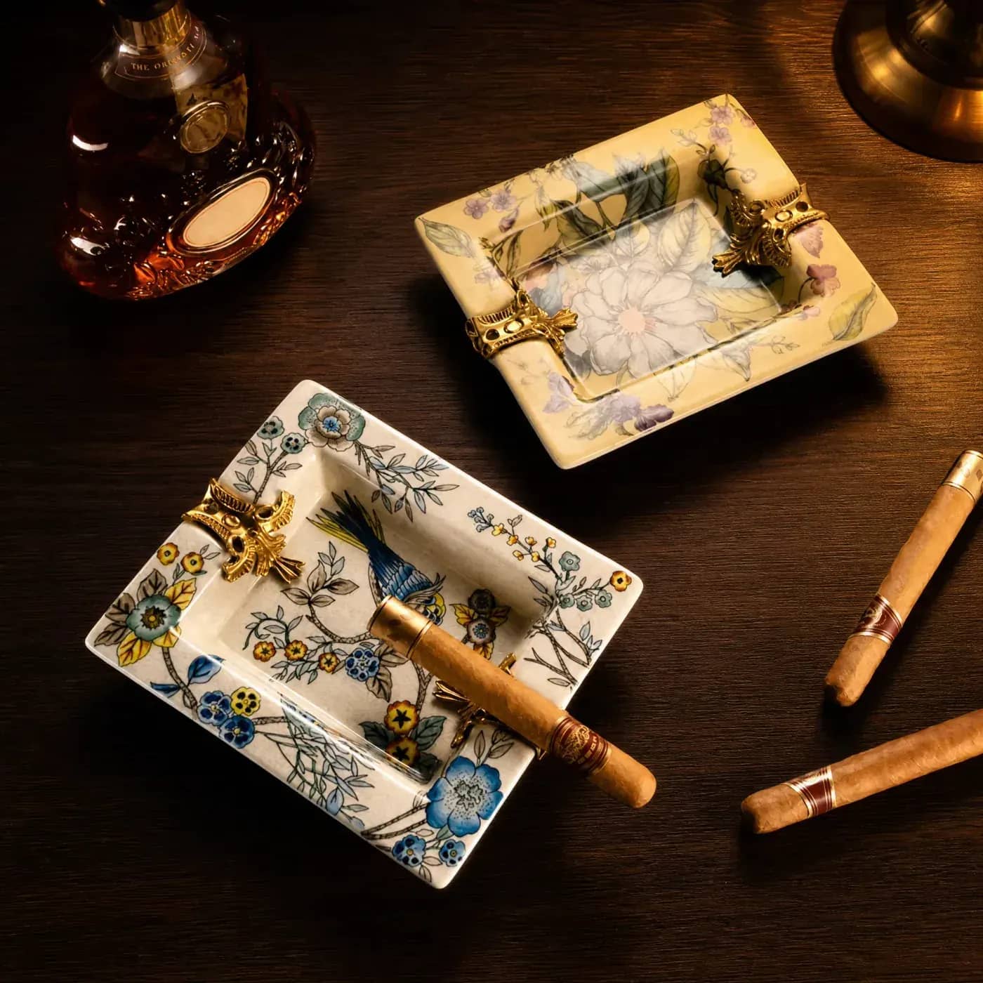 Ceramic cigar ashtrays with botanical decoration and gold rests for lounge programmes Ceramic cigar ashtrays with botanical decoration and gold rests for lounge programmes