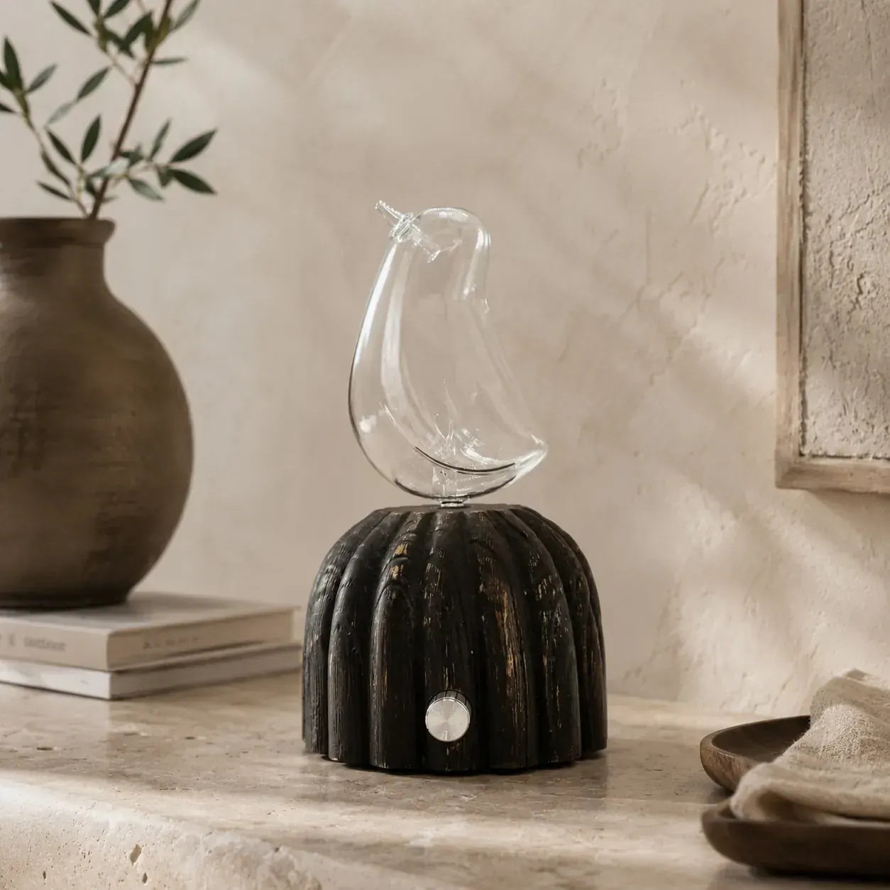 Dual-Fluid Aroma Diffuser — sculptural glass on wood base Sculptural glass dual-fluid aroma diffuser on a fluted dark wood base