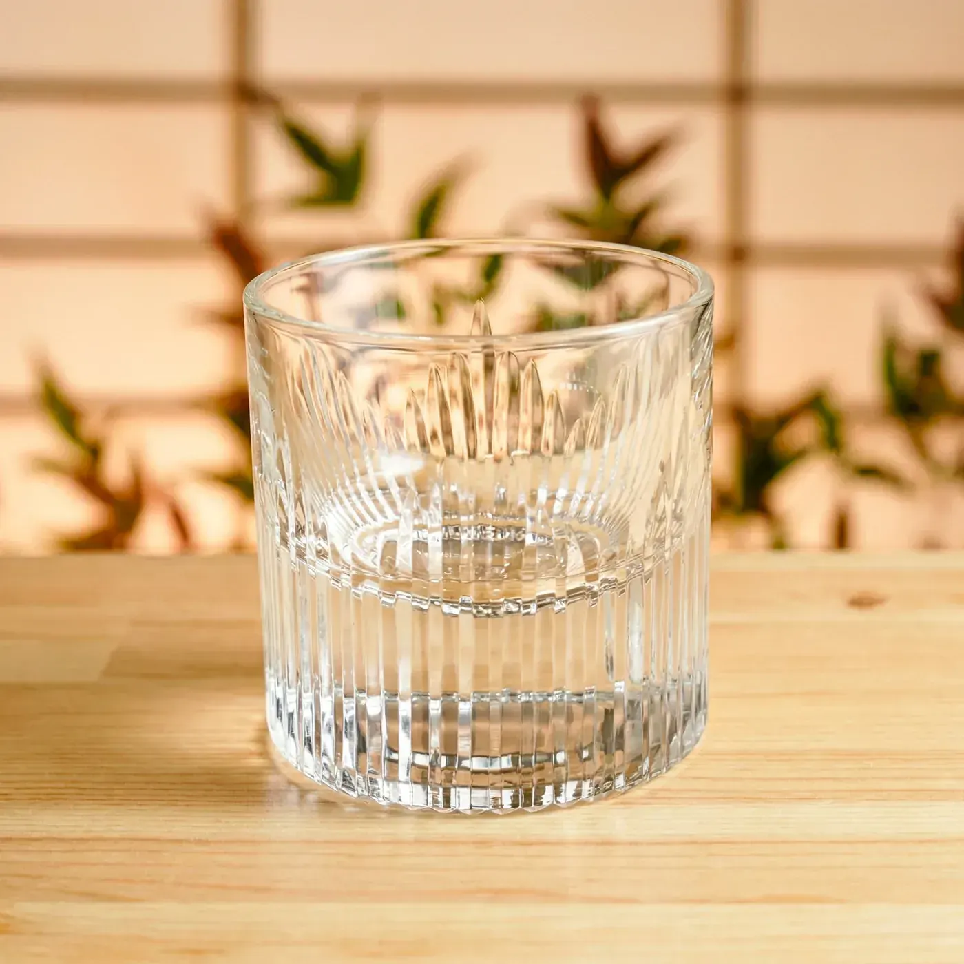 Edo Kiriko Glassware — flame-cut crystal tumbler Clear Edo Kiriko tumbler with radiating flame-cut pattern in a Japanese interior