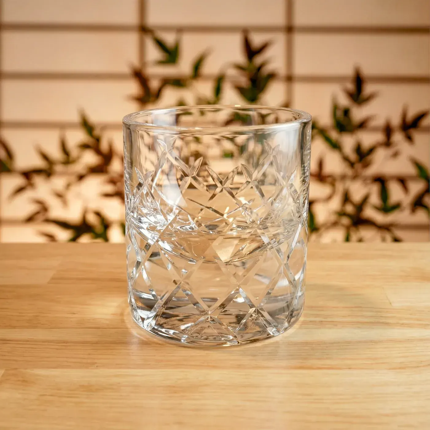 Edo Kiriko Glassware — basket-weave rocks glass Clear Edo Kiriko rocks glass with basket-weave cut pattern on a wooden table