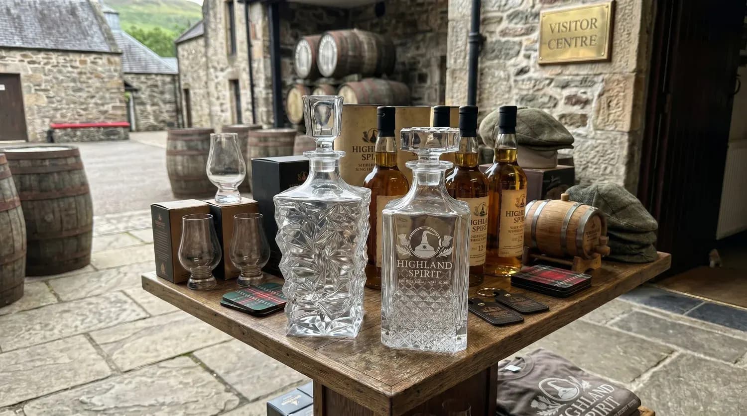 Branded whiskey decanter displayed at a distillery tasting counter Branded whiskey decanter displayed at a distillery tasting counter