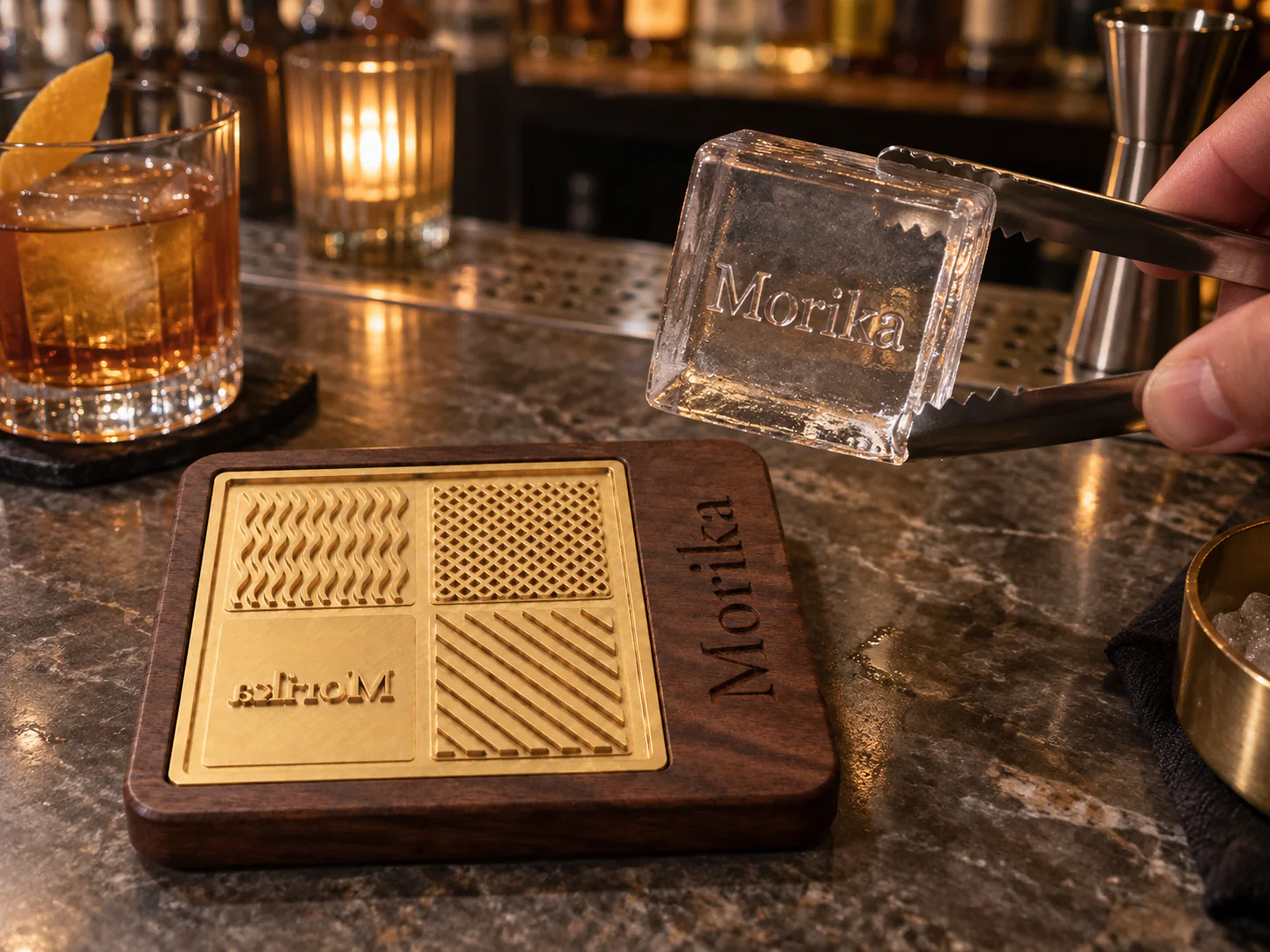 Copper and black walnut ice branding stamp on a bar with a clear cube pressed with a brand mark Copper and black walnut ice branding stamp on a bar with a clear cube pressed with a brand mark