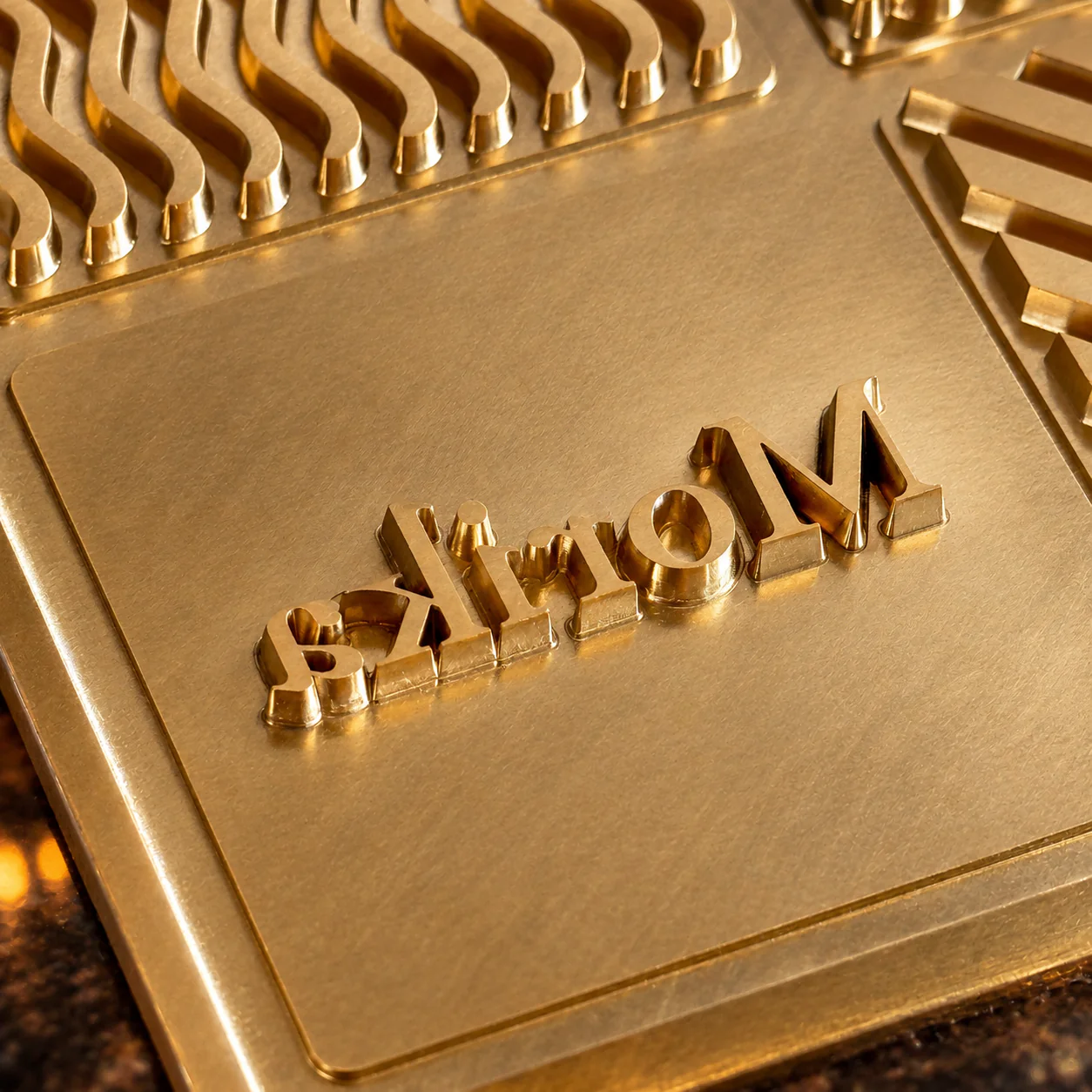 Ice Branding Stamp — logo cut into copper Close view of a copper ice-stamp plate cut with a raised brand logo